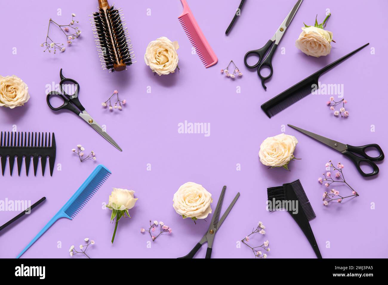 Frame made of hairdresser's tools with beautiful roses and gypsophila