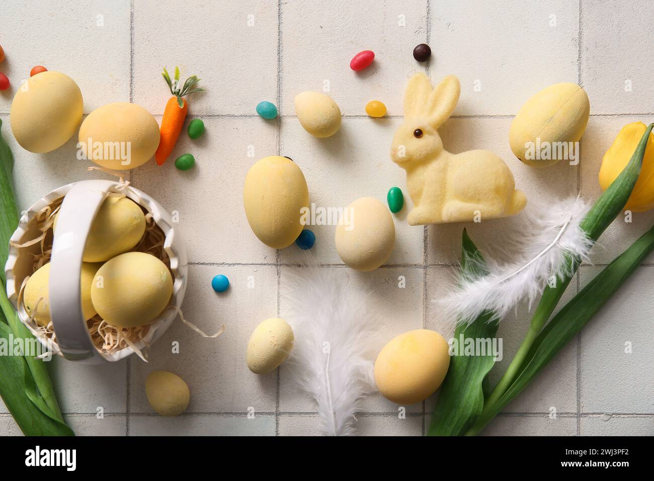 Ceramic basket with painted Easter eggs, tulip flowers and bunny on ...