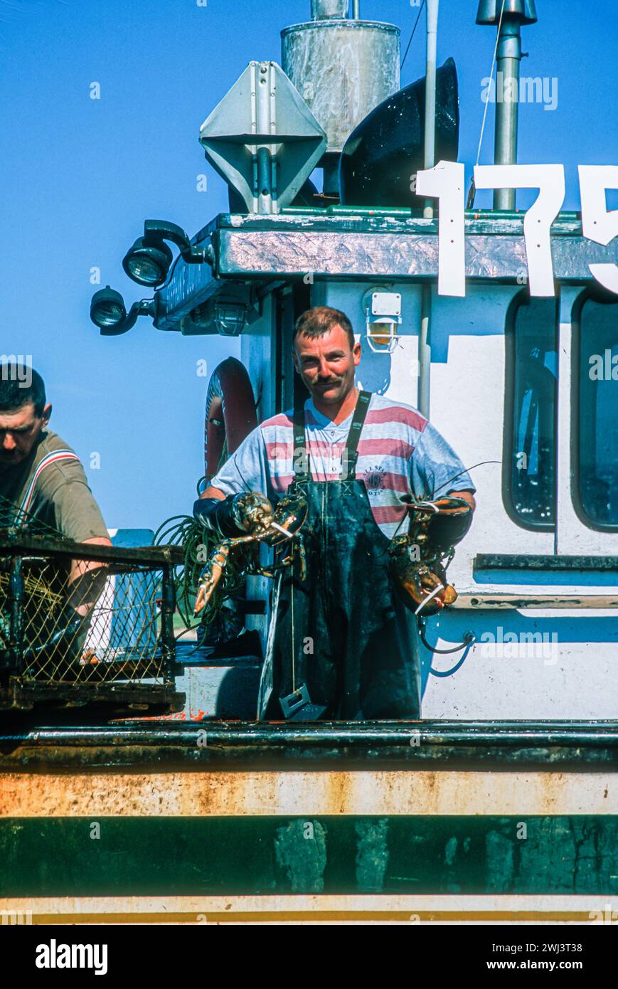 Lobstering off the coast of cap aux Meules, Isles d' Madeleine, Magdalen Islands, in the Gulf of St Lawrence, Quebec, Canada Stock Photo