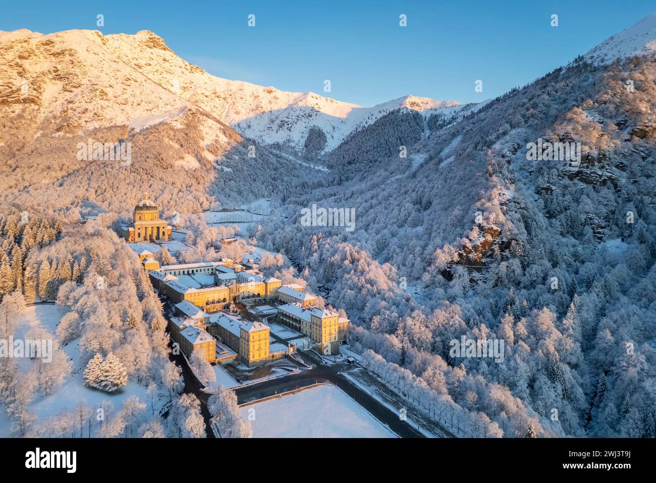 Aerial view of the Sanctuary of Oropa in winter at dawn. Biella, Biella district, Piedmont, Italy, Europe. Stock Photo