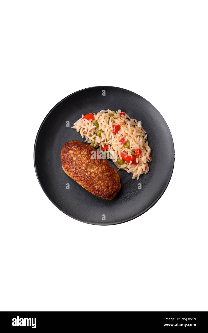 Delicious fried cutlets or meatballs of minced fish with rice Stock Photo
