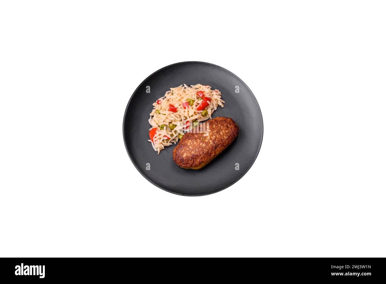 Delicious fried cutlets or meatballs of minced fish with rice Stock Photo