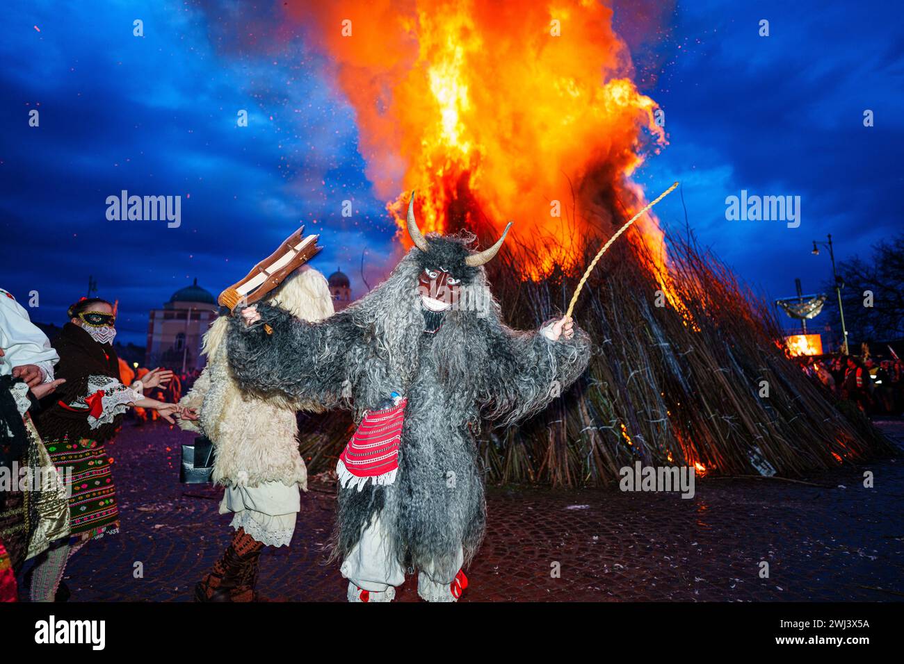 MOHACS, HUNGARY - FEBRUARY 12: Busojaras carnival. Unidentified person wearing mask for spring greetings. February 12, 2024 in Mohacs, Hungary. Stock Photo