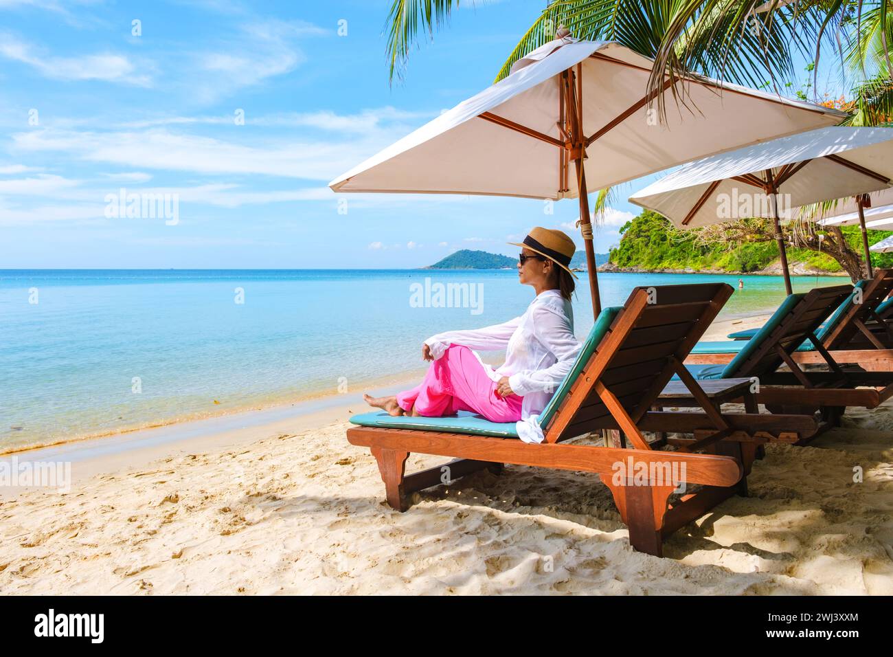 Asian woman on a beach chair on the beach of Koh Samet Island Rayong Thailand Stock Photo