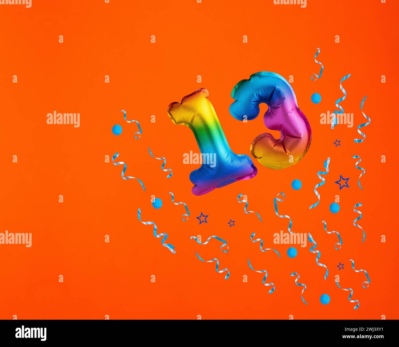 Confetti explosion with number 13 balloon - Celebration on orange ...
