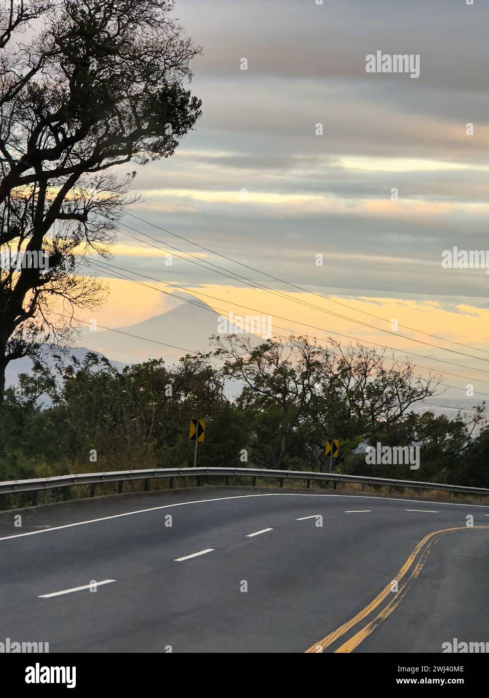 Road on mountain sunrise background. Highway speedway in central america Stock Photo