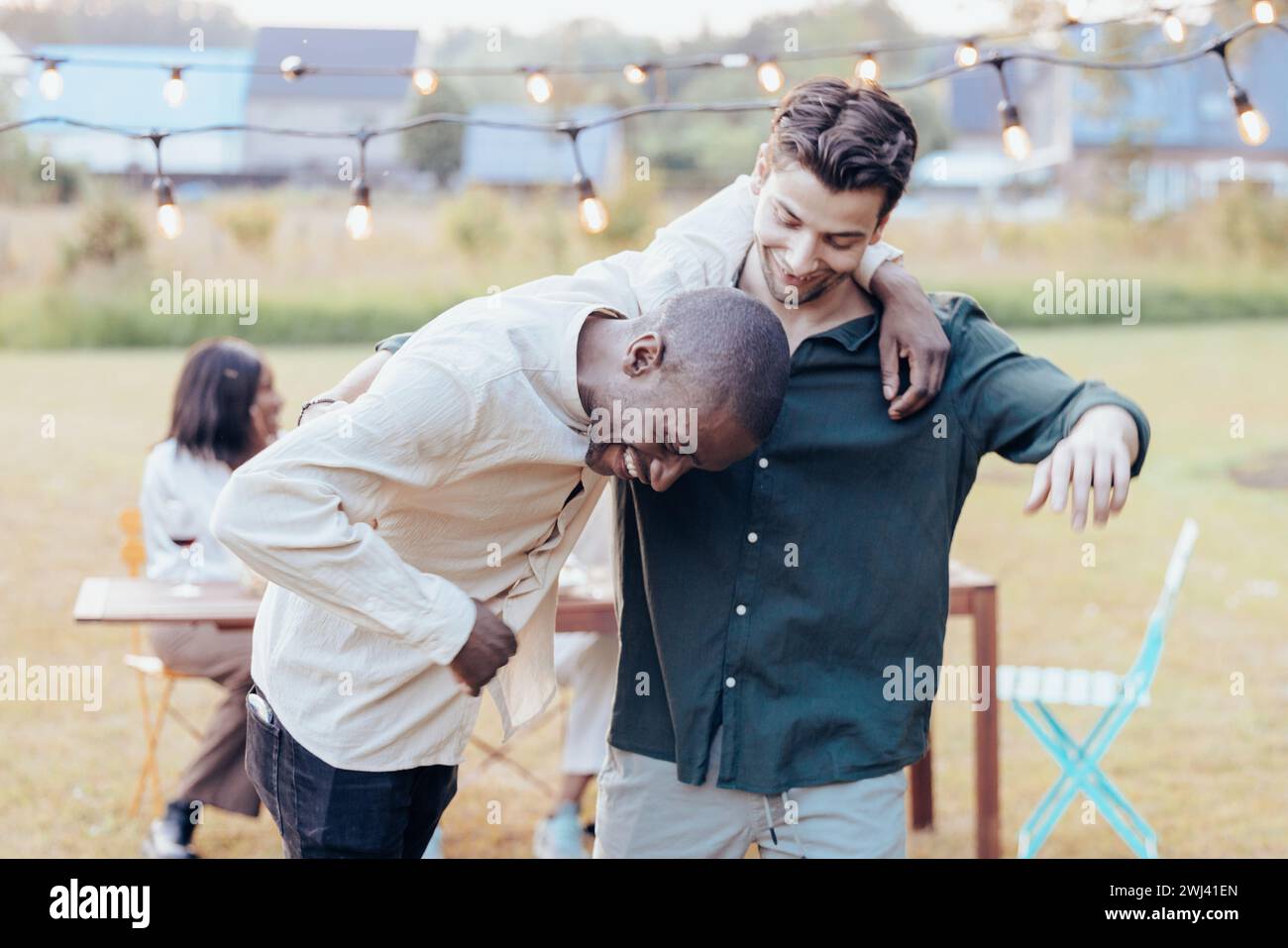 Shared Humor: A Moment of Laughter Between Friends Stock Photo