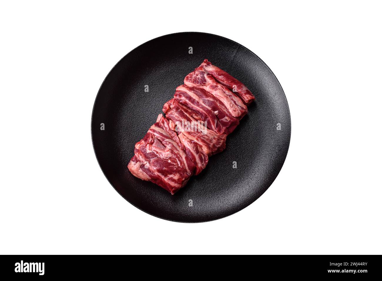 Fresh raw beef ribs with salt, spices and herbs Stock Photo