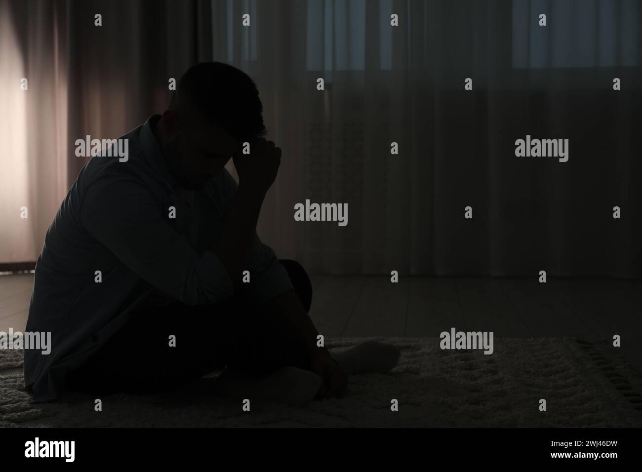 Man in dark room hi-res stock photography and images - Alamy