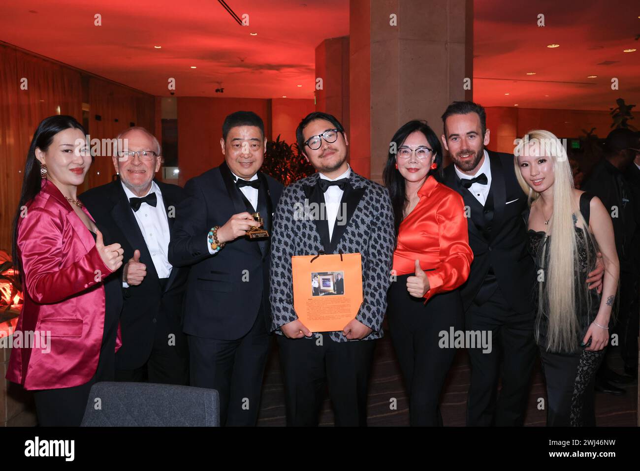 Beverly Hills, California, USA. 10th February, 2024. Actress/producer Rachel Liu Yue, director/filmmaker, Harrison Engle, TV host/founder of Los Angeles Beverly Arts (LABA), Joey Zhou, DGA awarding-director Daniel Kwan (co-director of 'Everything Everywhere All at Once') with gift from LABA Blue-chip artist Jiannan Huang, director Maria Meimei Yue, Maxwell Gobbell, and Nicolette Anqi Xiang attending the 76th Annual Directors Guild of America Awards at the Beverly Hilton Hotel in Beverly Hills, California. Credit: Sheri Determan Stock Photo