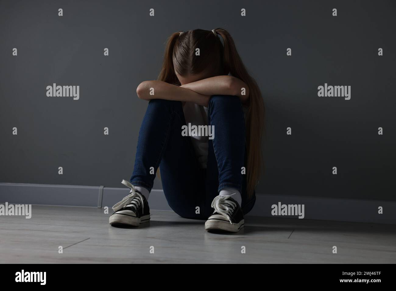 Sad girl preteen sitting on hi-res stock photography and images - Alamy