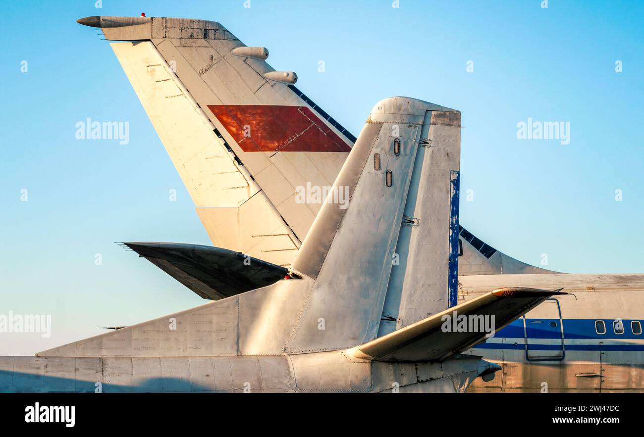 Tail and wings of large old airliners with the symbol of the Soviet Union Stock Photo