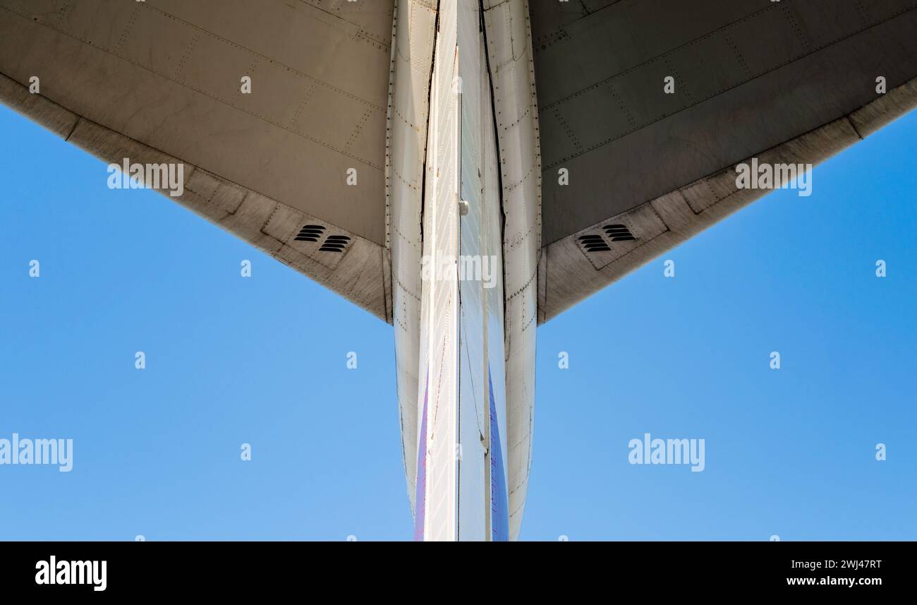 Fragment of airplane wings on a background of blue sky Stock Photo