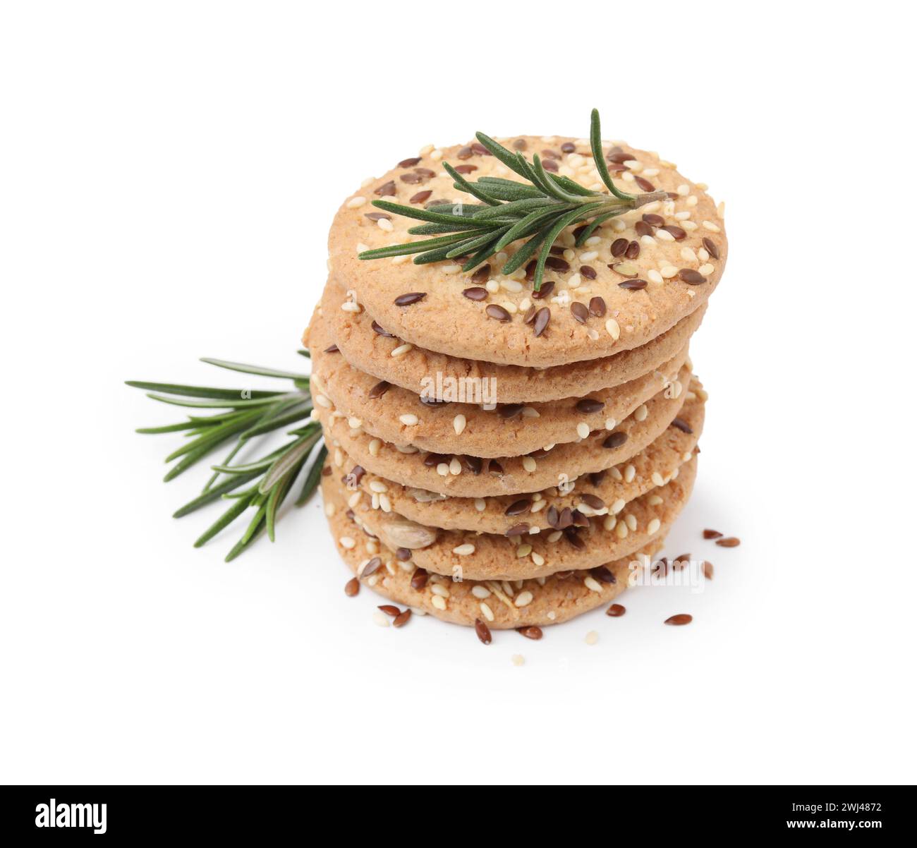 Stack of round cereal crackers with flax, sunflower, sesame seeds and ...