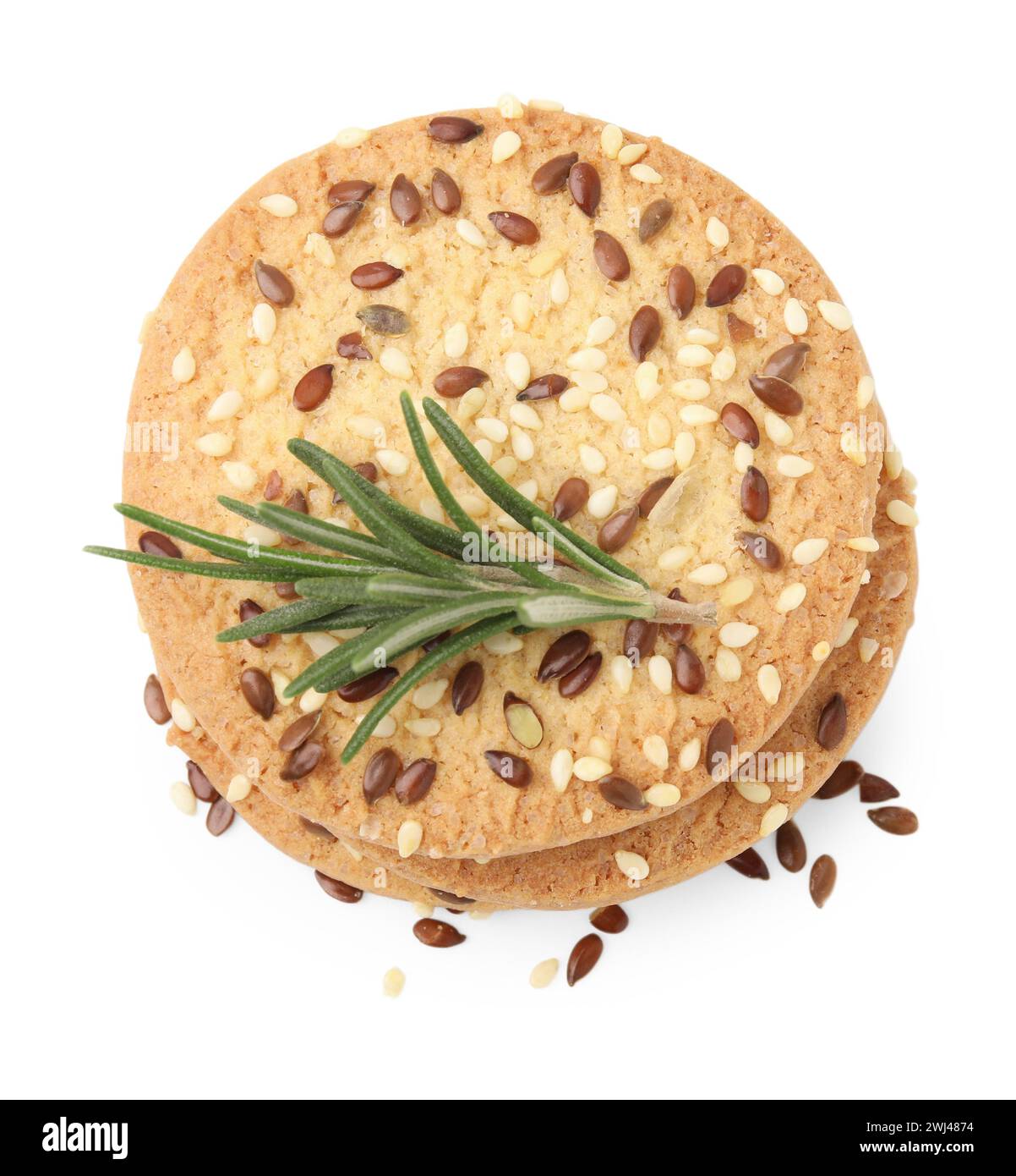 Stack of round cereal crackers with flax, sunflower, sesame seeds and ...