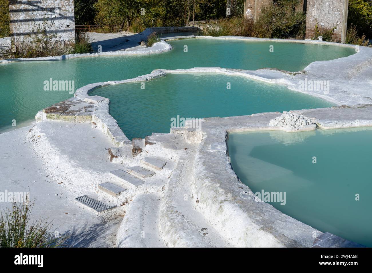 Turquoise hot spring pools in white gypsum baths in Bagni San Filippo in Tuscany Stock Photo