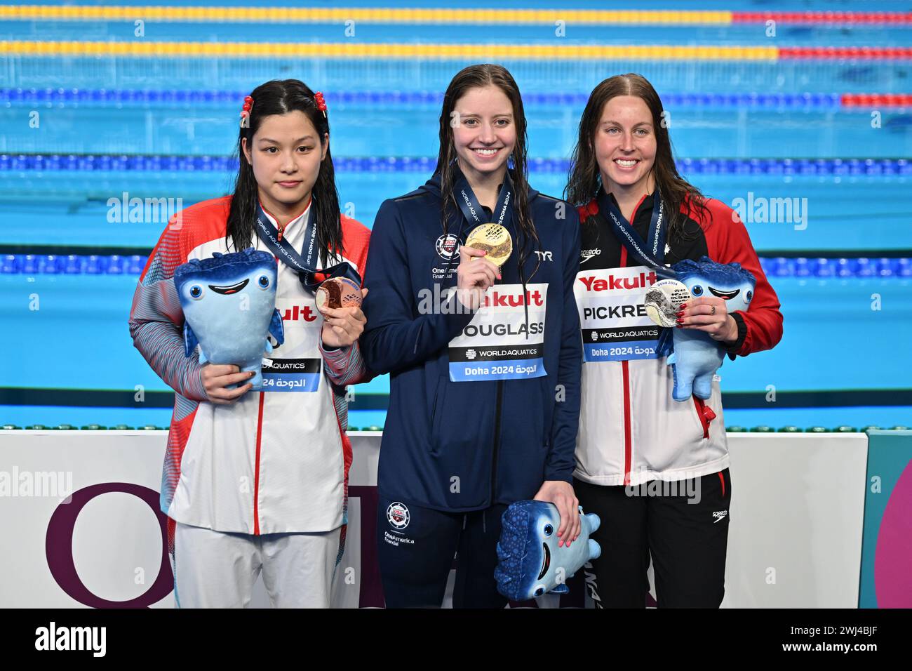 Doha, Qatar. 12th Feb, 2024. Gold medalist Kate Douglass(C) of the United States, silver medalist Sydney Pickrem (R) of Canada, bronze medalist Yu Yiting of China pose for photos after the awarding ceremony of the women's 200m individual medley final of swimming event at the World Aquatics Championships 2024 in Doha, Qatar, Feb. 12, 2024. Credit: Xue Yuge/Xinhua/Alamy Live News Stock Photo