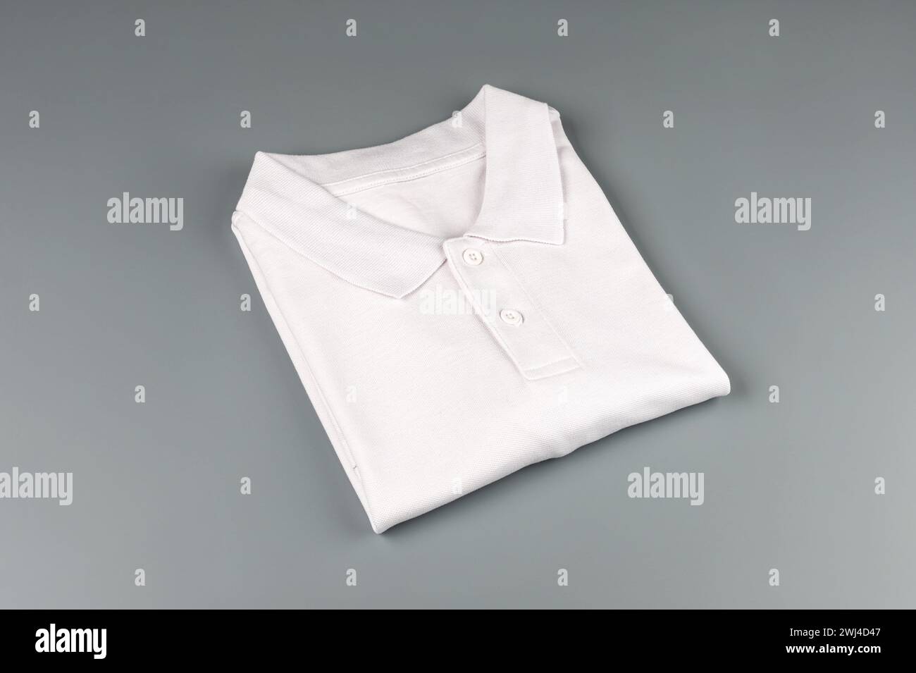 White Polo shirt, on isolated white background. Stock Photo