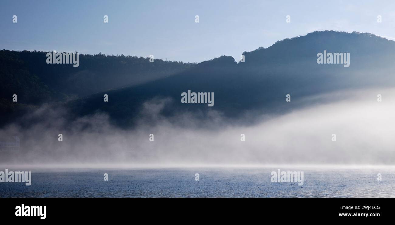 Edertalsperre with wafts of fog on the Edersee in the early morning, Edertal, Hesse, Germany, Europe Stock Photo