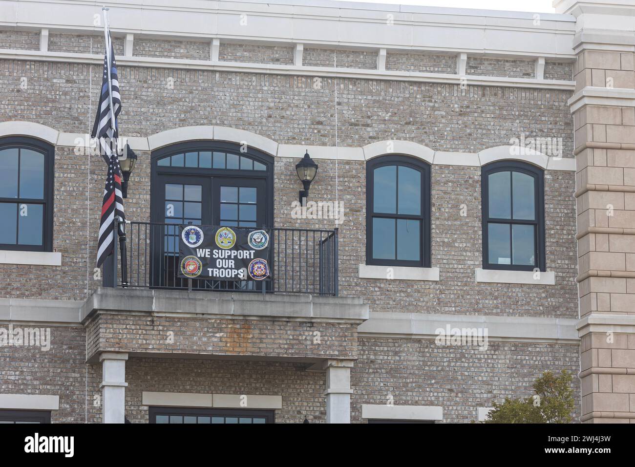 Suwanee, GA / USA August 4, 2023 A banner that says "We support our