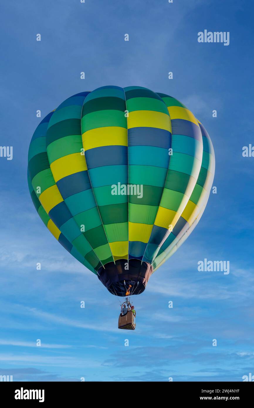 Spectacular Sky Ballet: Dazzling Balloons Paint the Blue Canvas with Joyful Colors Stock Photo