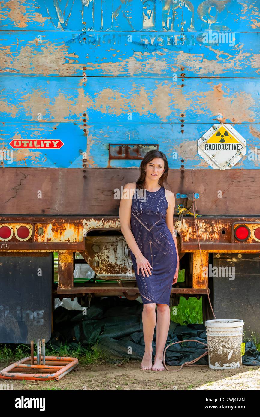 Campus Elegance: Brunette Beauty Strikes a Pose, Capturing the Essence of Academic Glamour Stock Photo