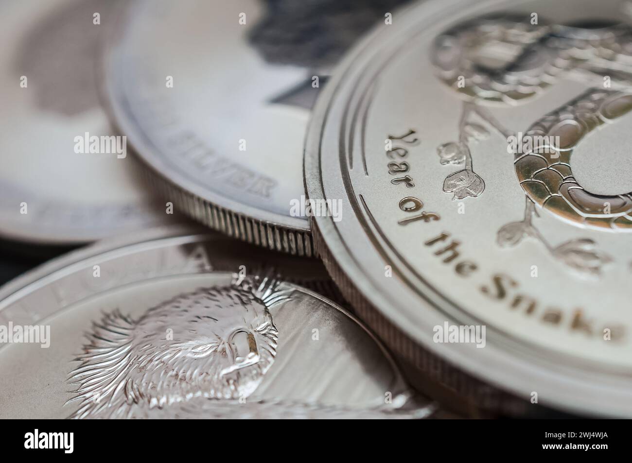 Silver coins in a pile Stock Photo - Alamy