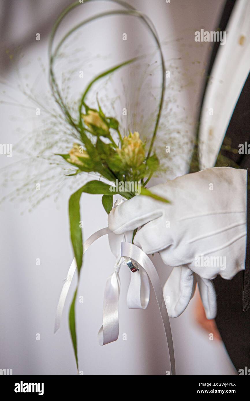 Bridal Elegance: White Glove and Floral Accent Stock Photo