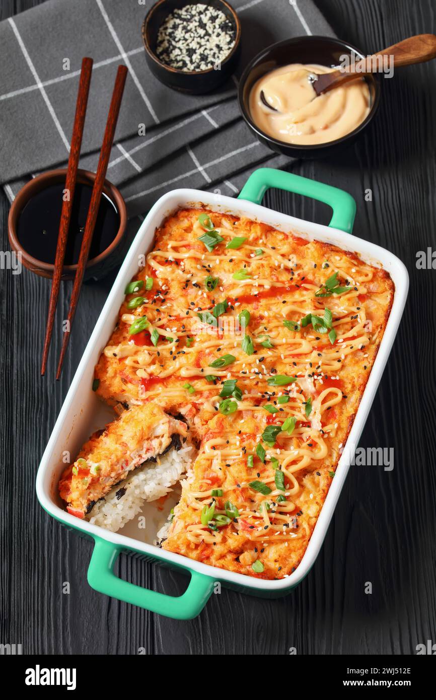 sushi bake, baked deconstructed salmon sushi rolls in baking dish on ...
