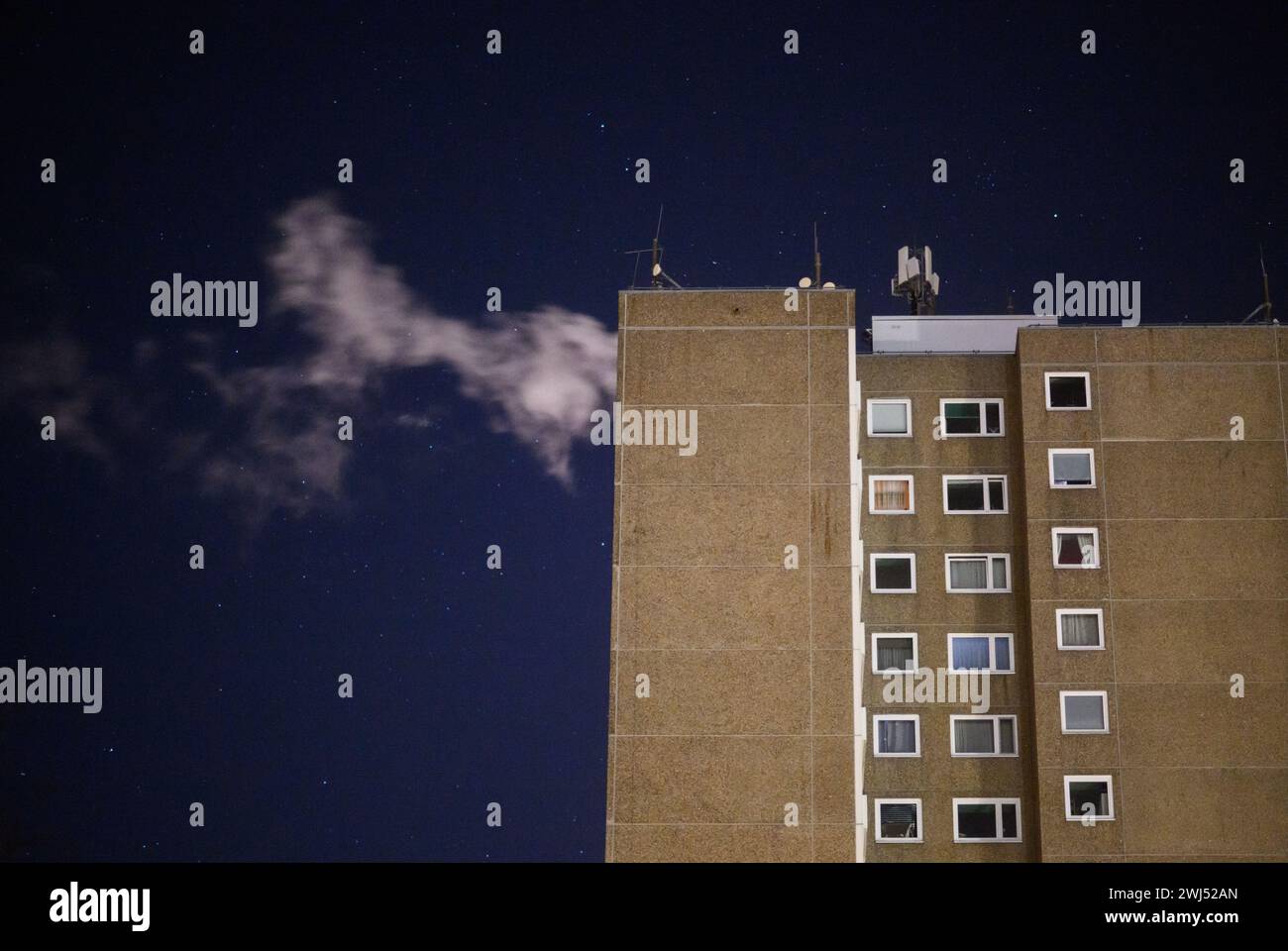 Laatzen, Germany. 13th Feb, 2024. Steam from a heating system rises from the roof of an apartment building in the Hanover region. The latest developments in the energy markets and energy policy are on the agenda at a meeting of the International Energy Agency (IEA). Energy security is also a topic. Credit: Julian Stratenschulte/dpa/Alamy Live News Stock Photo