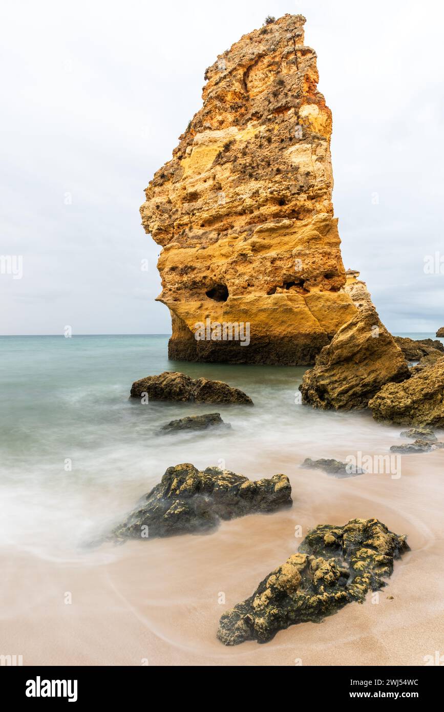 Rocky cliffs on sandy Marinha Beach in Algarve coast at Atlantic Ocean in Portugal Stock Photo