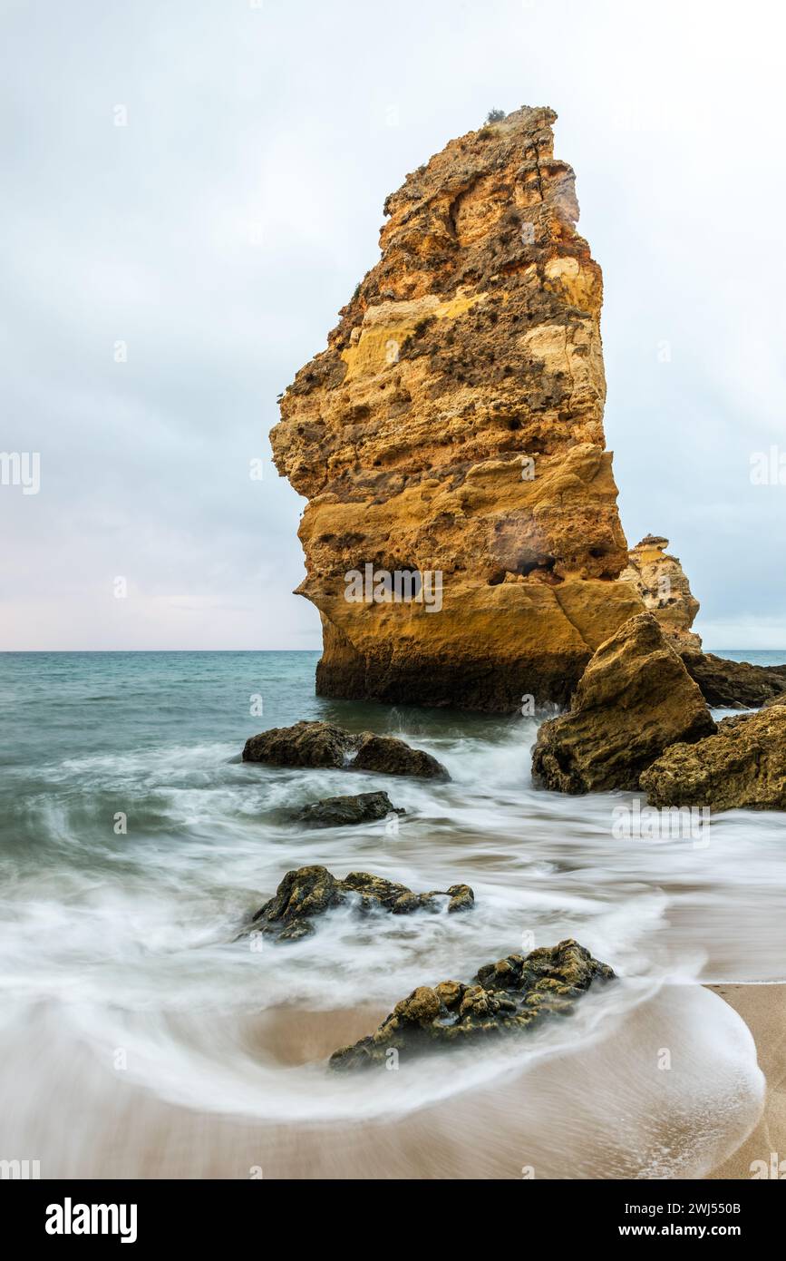 Rocky cliffs on sandy Marinha Beach in Algarve coast at Atlantic Ocean in Portugal Stock Photo