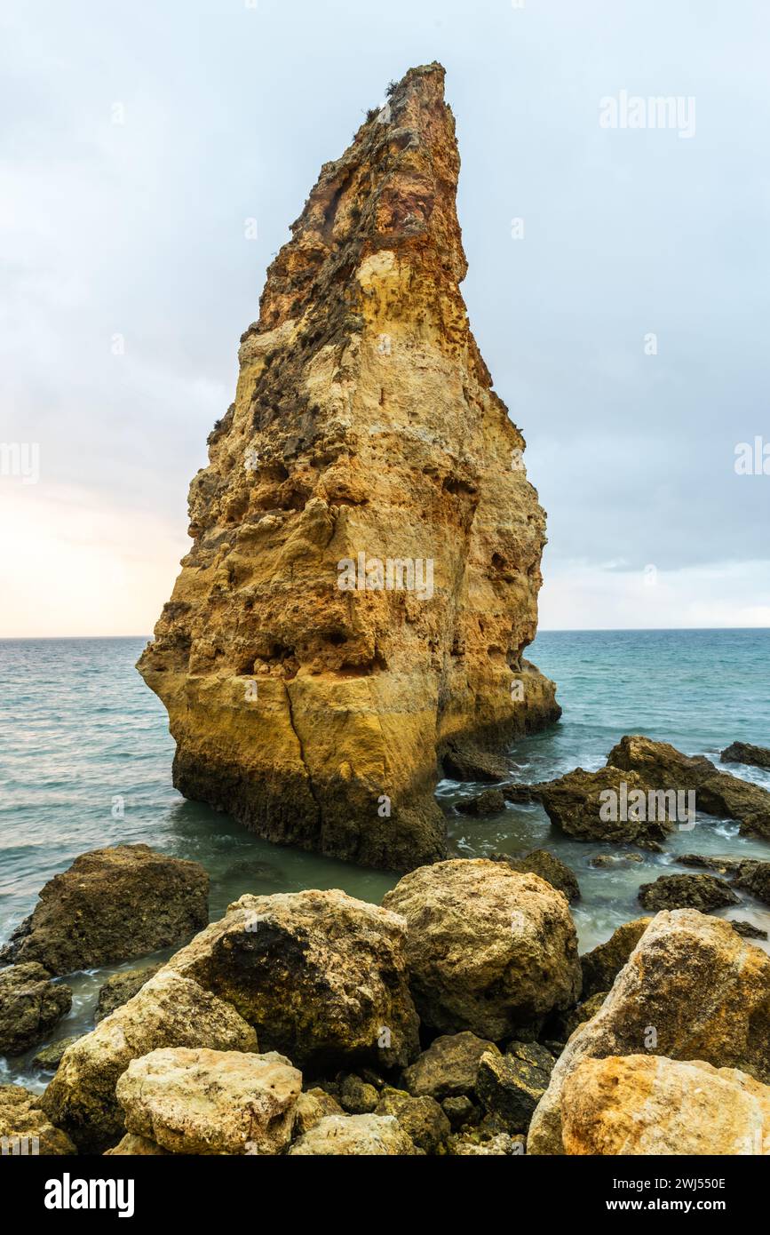 Rocky cliffs on sandy Marinha Beach in Algarve coast at Atlantic Ocean in Portugal Stock Photo