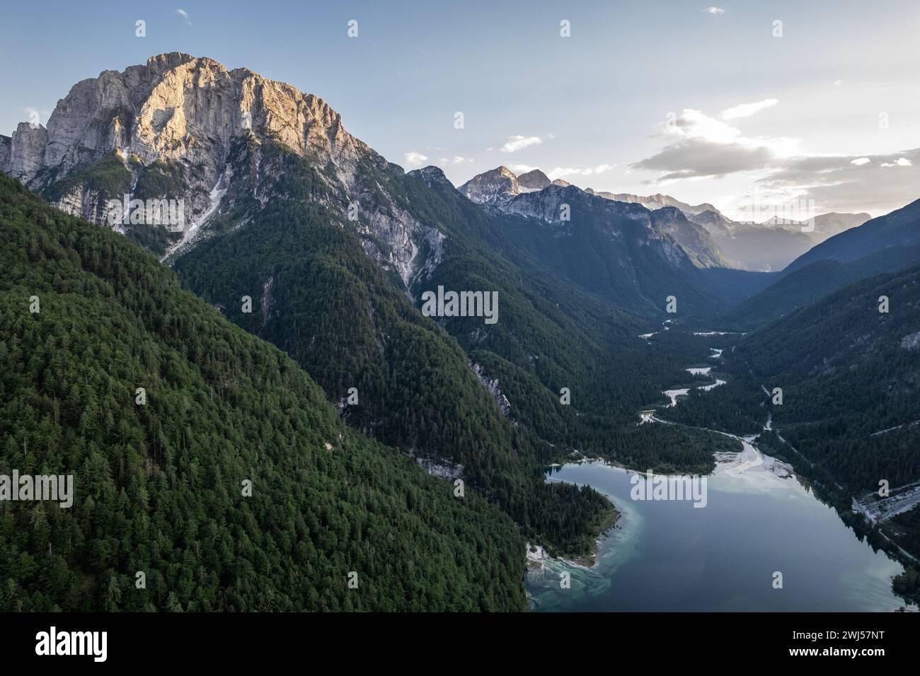 Predil Lake and Alpine mountains landscape in Italy. Aerial drone view Stock Photo