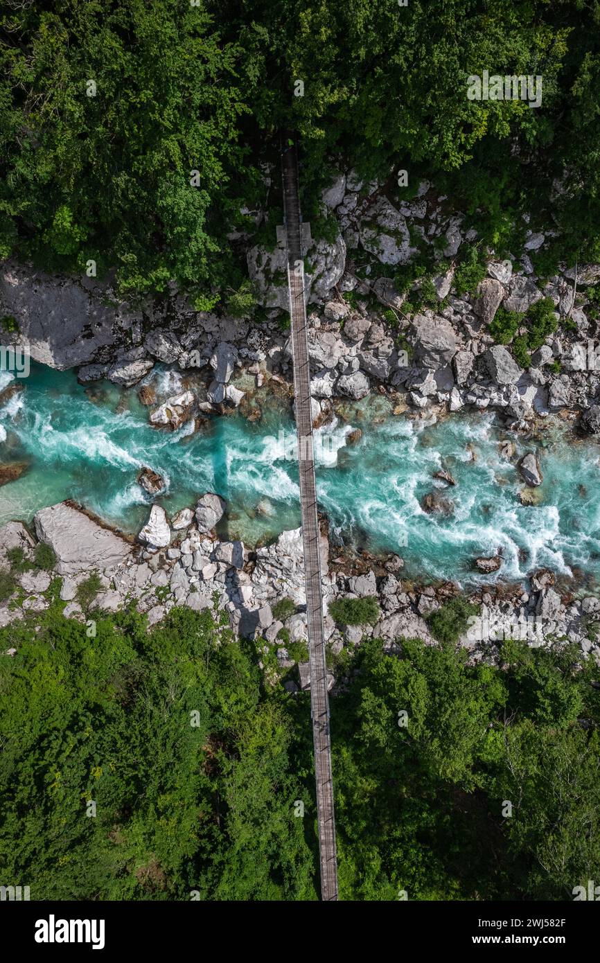 Aerial drone view of suspension bridge over Soca river in Slovenia Stock Photo