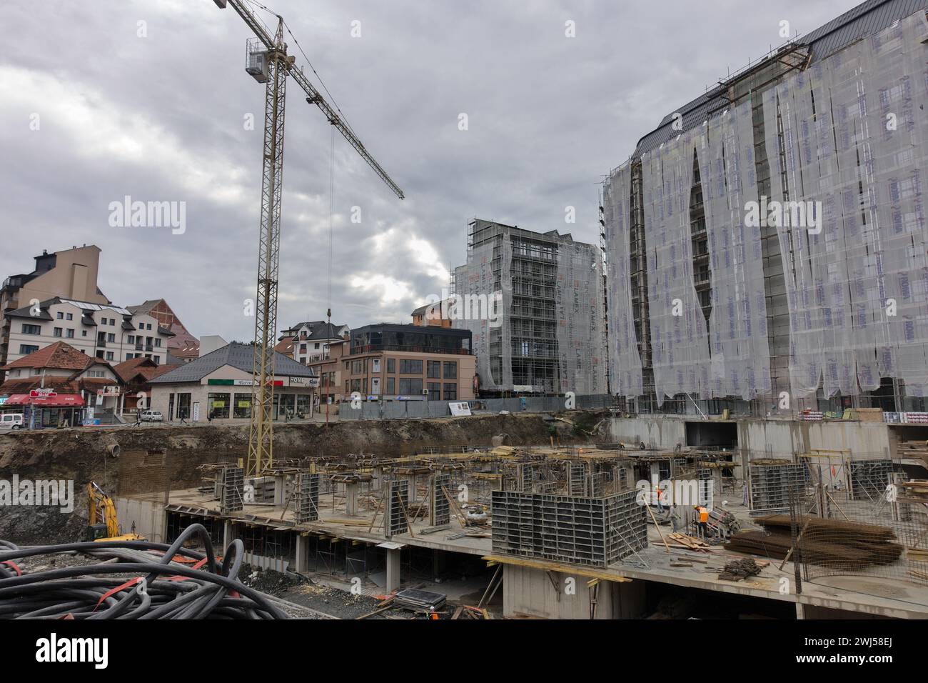 construction site with cranes on gloomy day in Zlatibor, Serbia Stock Photo