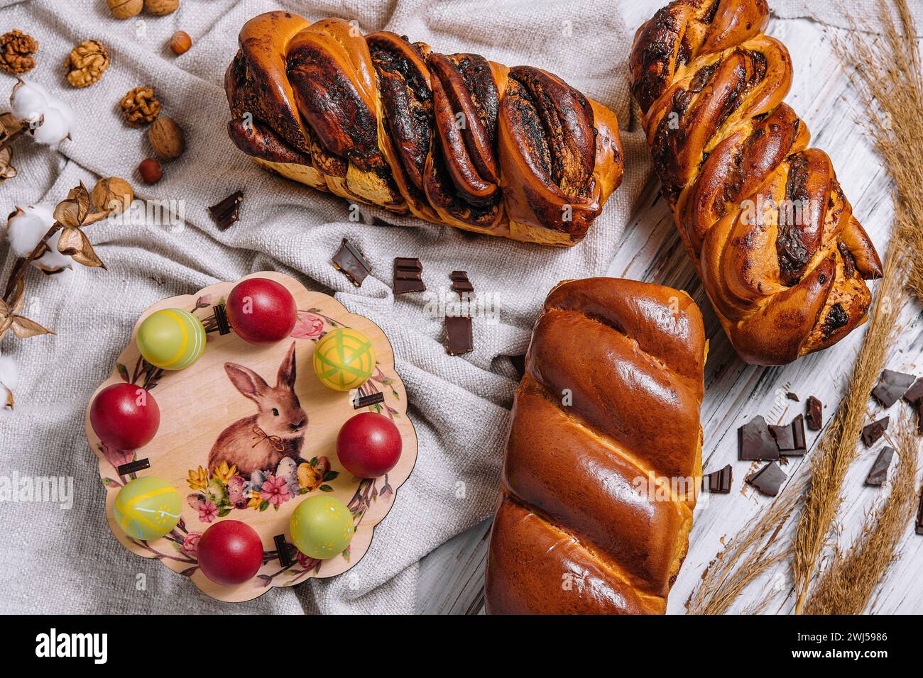 Easter eggs with buns on top view Stock Photo - Alamy