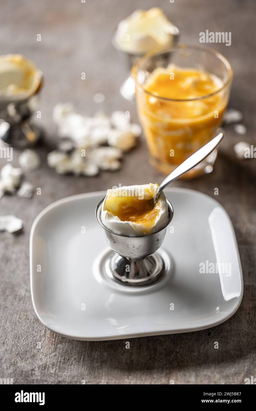 Soft-boiled eggs in a glass cup for breakfast. Stock Photo