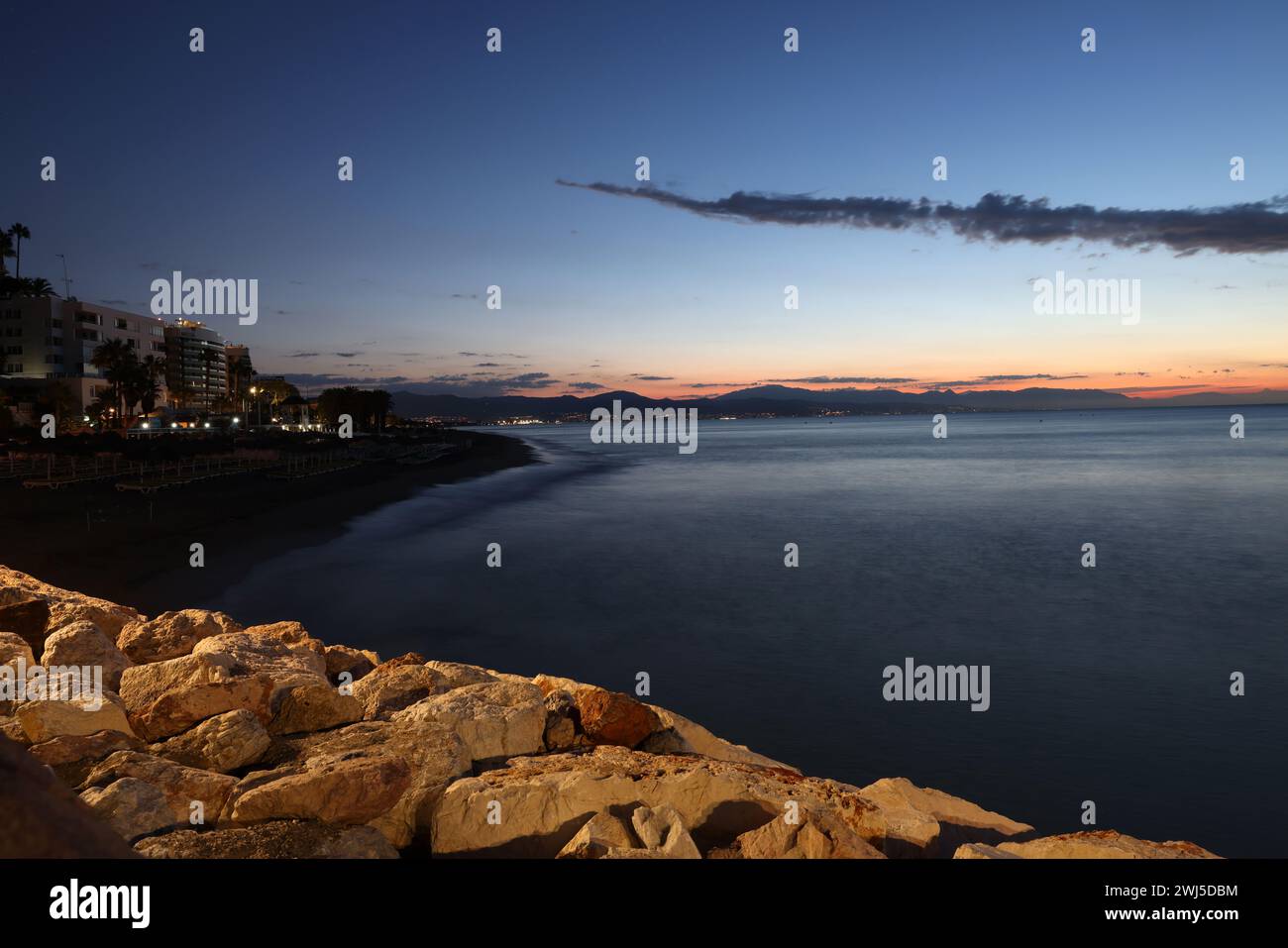 View from Torremolinos towards Malaga just before sunrise. Costa del Sol, Spain. Stock Photo