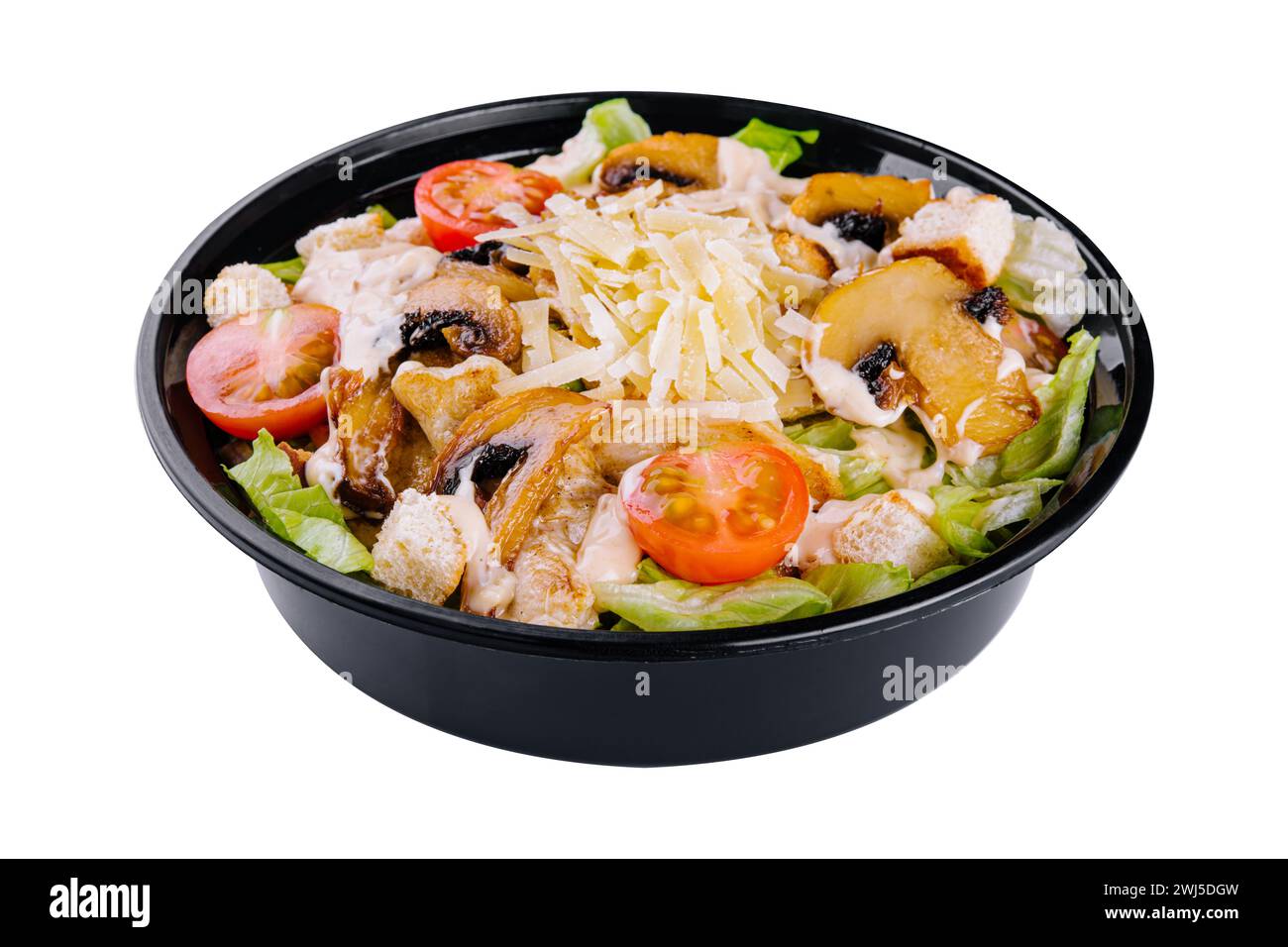 Warm salad with roasted chicken meat, vegetables and mushrooms Stock Photo