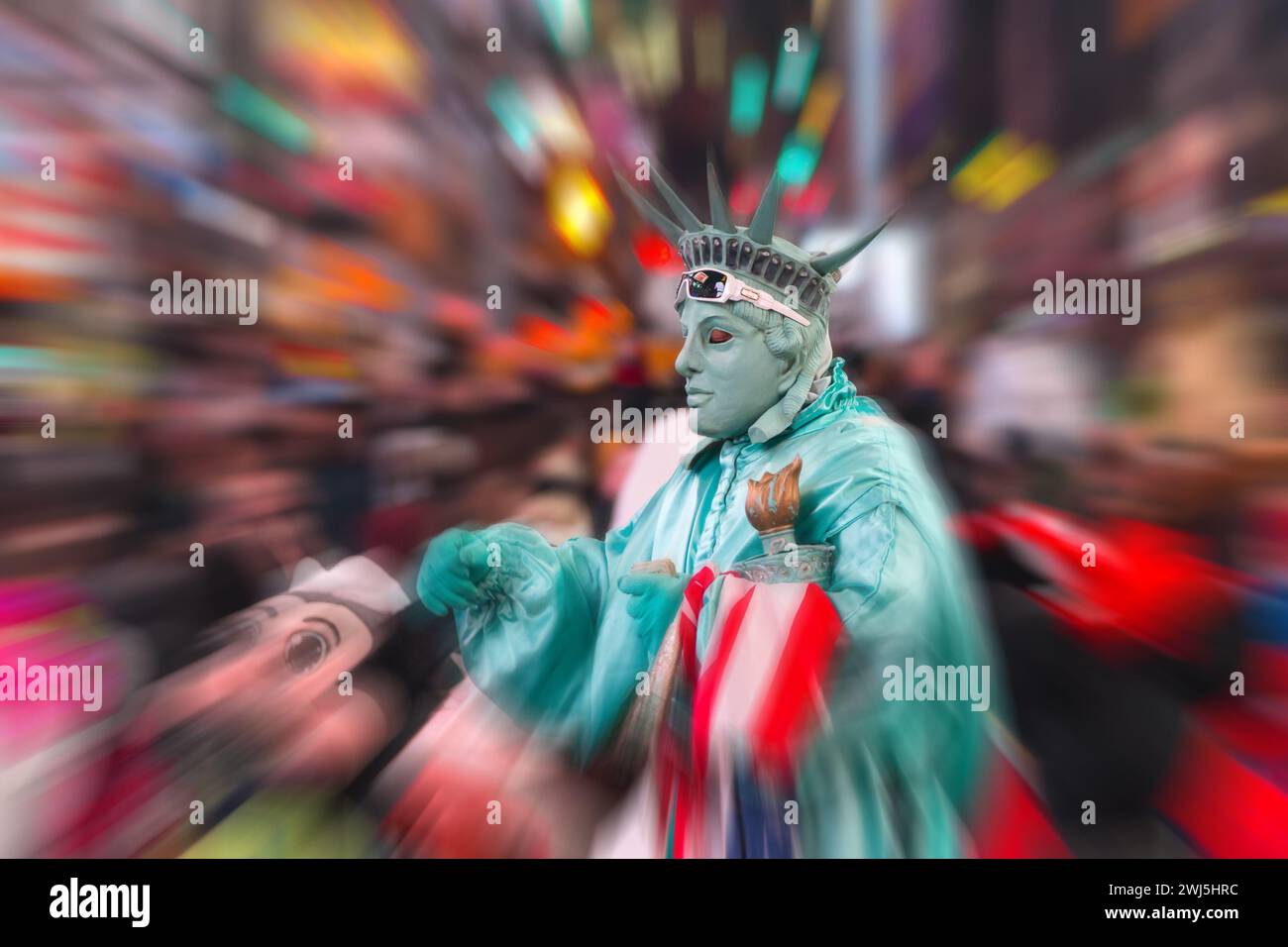 Night view of the Times Square street with street artists and huge crowd with motion blur effect Stock Photo