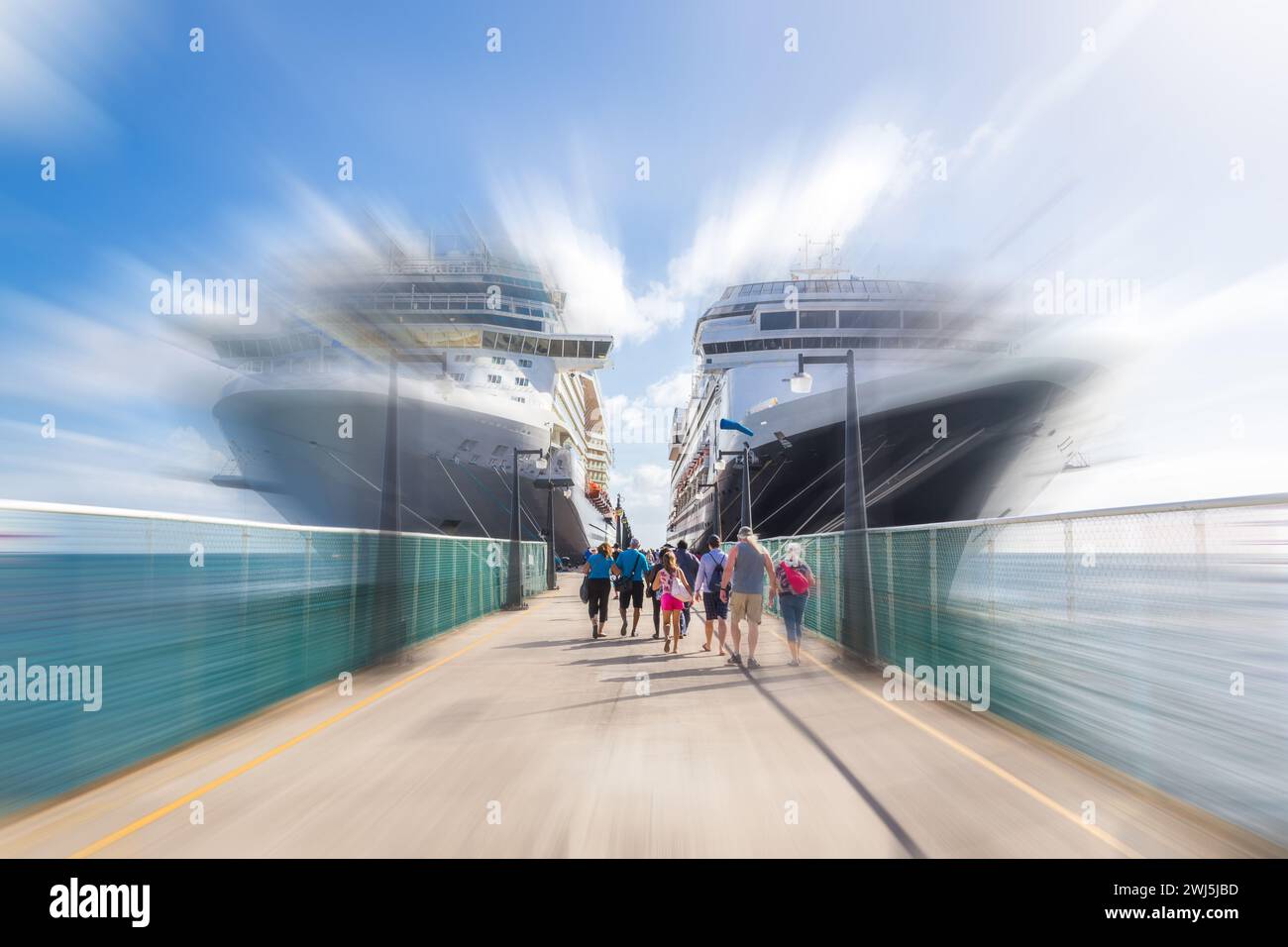 Cruise passengers return to cruise ships at St Kitts Port Zante cruise ship terminal with motion blur effect Stock Photo