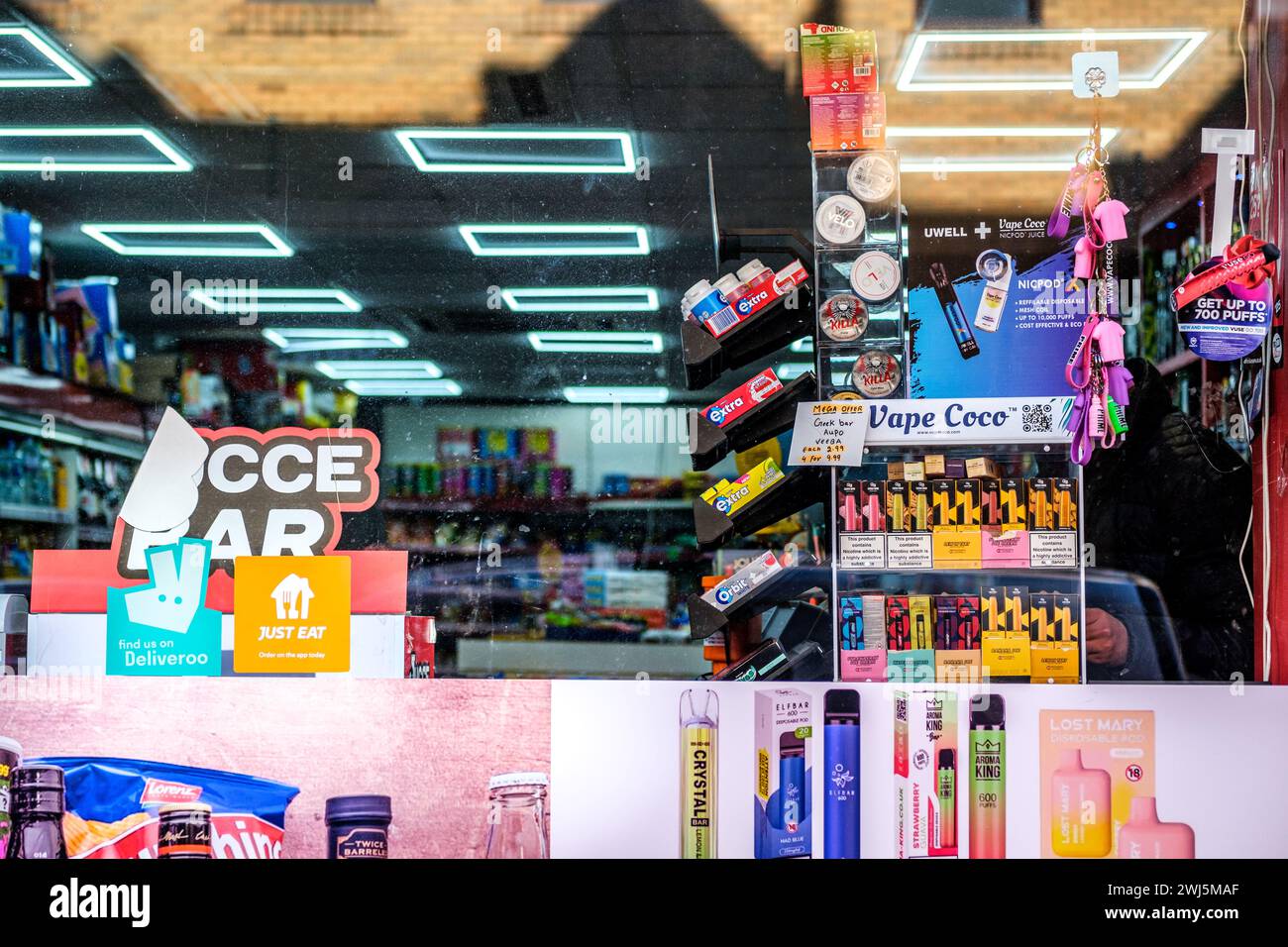Kingston-Upon-Thames, London UK, February 12 2024, Independent Corner Shop or Mini-Market Selling Vapes and assorted Products Stock Photo