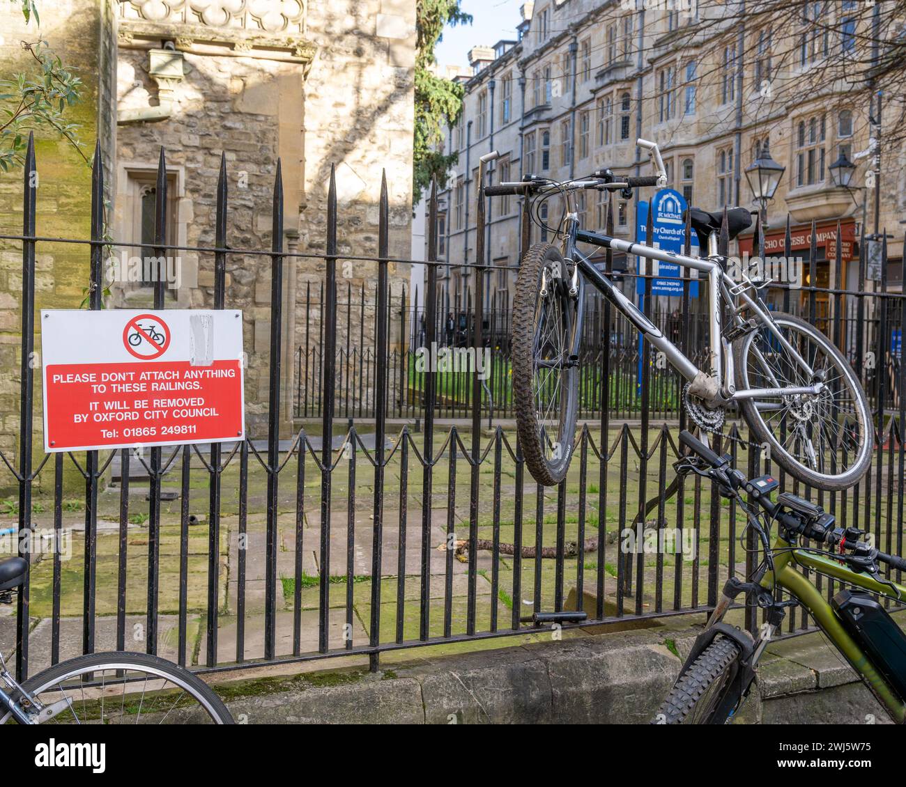 Bicycles up against railings Stock Photo