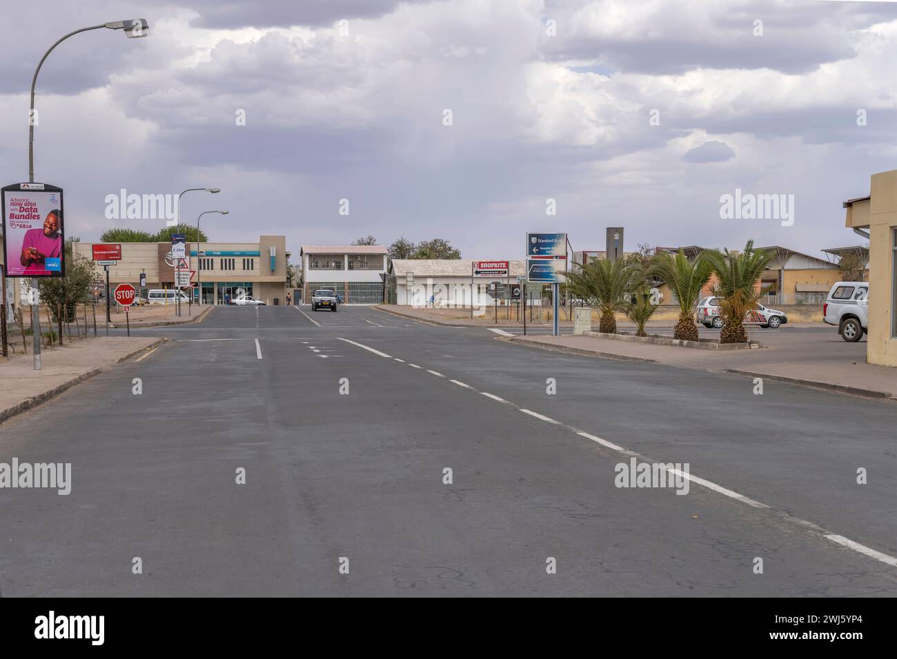 MARIENTAL, 2023 nov 15: cityscape with almost empty street at noon, shot in bright cloudy  late spring light  on nov 15 2023 at Mariental, Namibia, Af Stock Photo