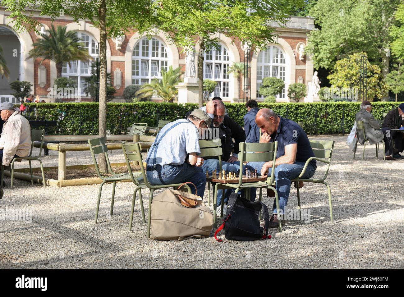 25.04. 2018 - France, Paris - People play chess in the park on a sunny holiday, strategy, leisure, and outdoor activities Stock Photo