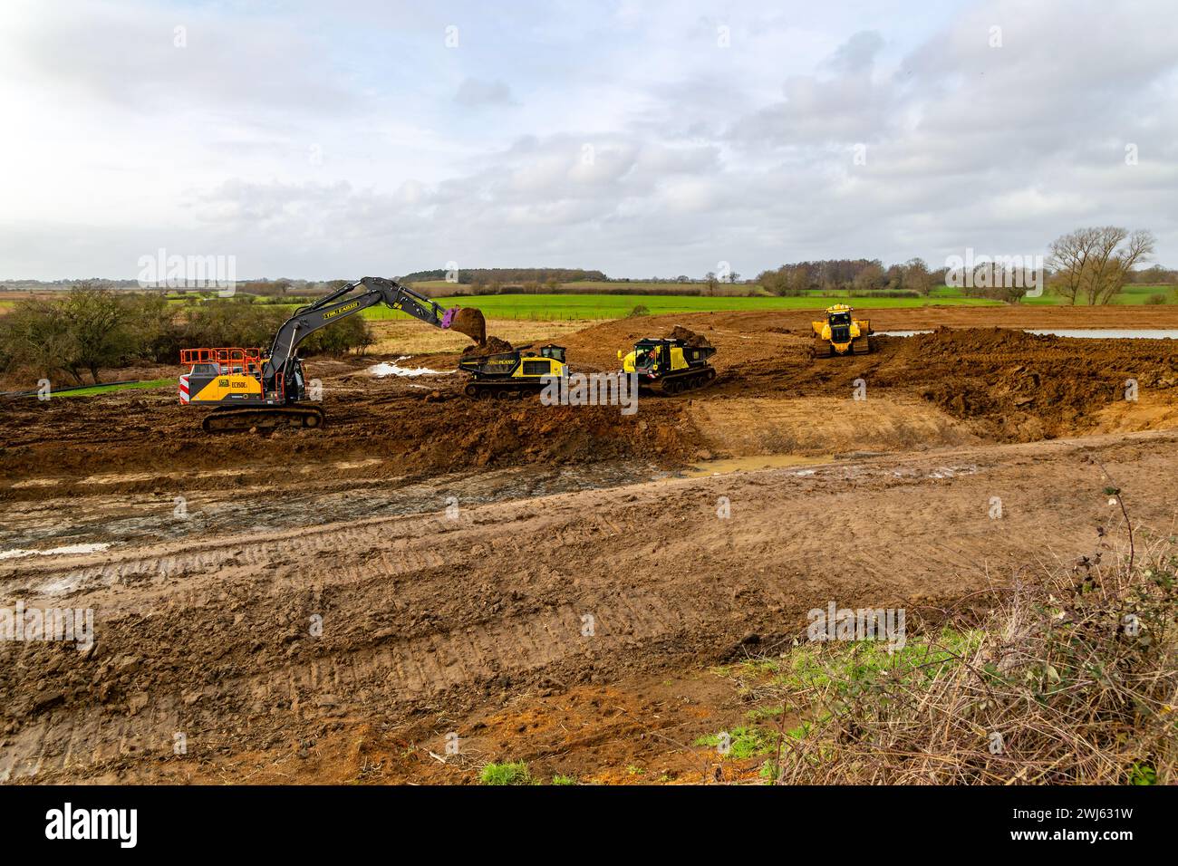 TRU PLANT hire heavy plant machinery constructing new reservoir, Shottisham, Suffolk, England, UK Stock Photo