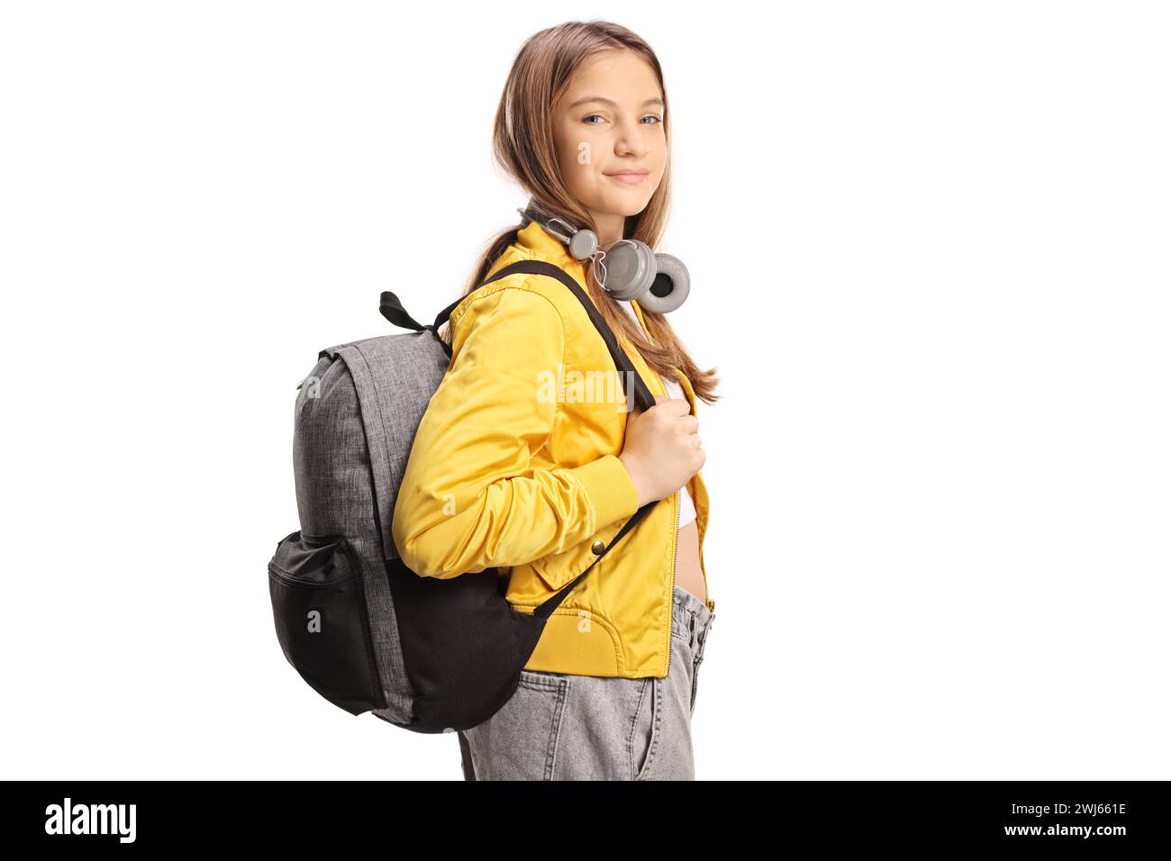 Female teen student with headphones and backpack isolated on white ...