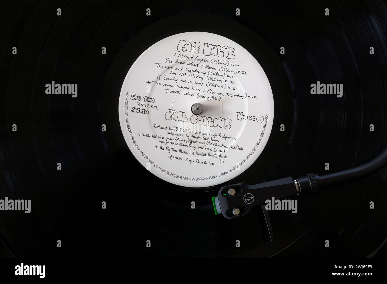 Phil Collins Face Value vinyl record album LP with tonearm, cartridge, headshell and stylus on