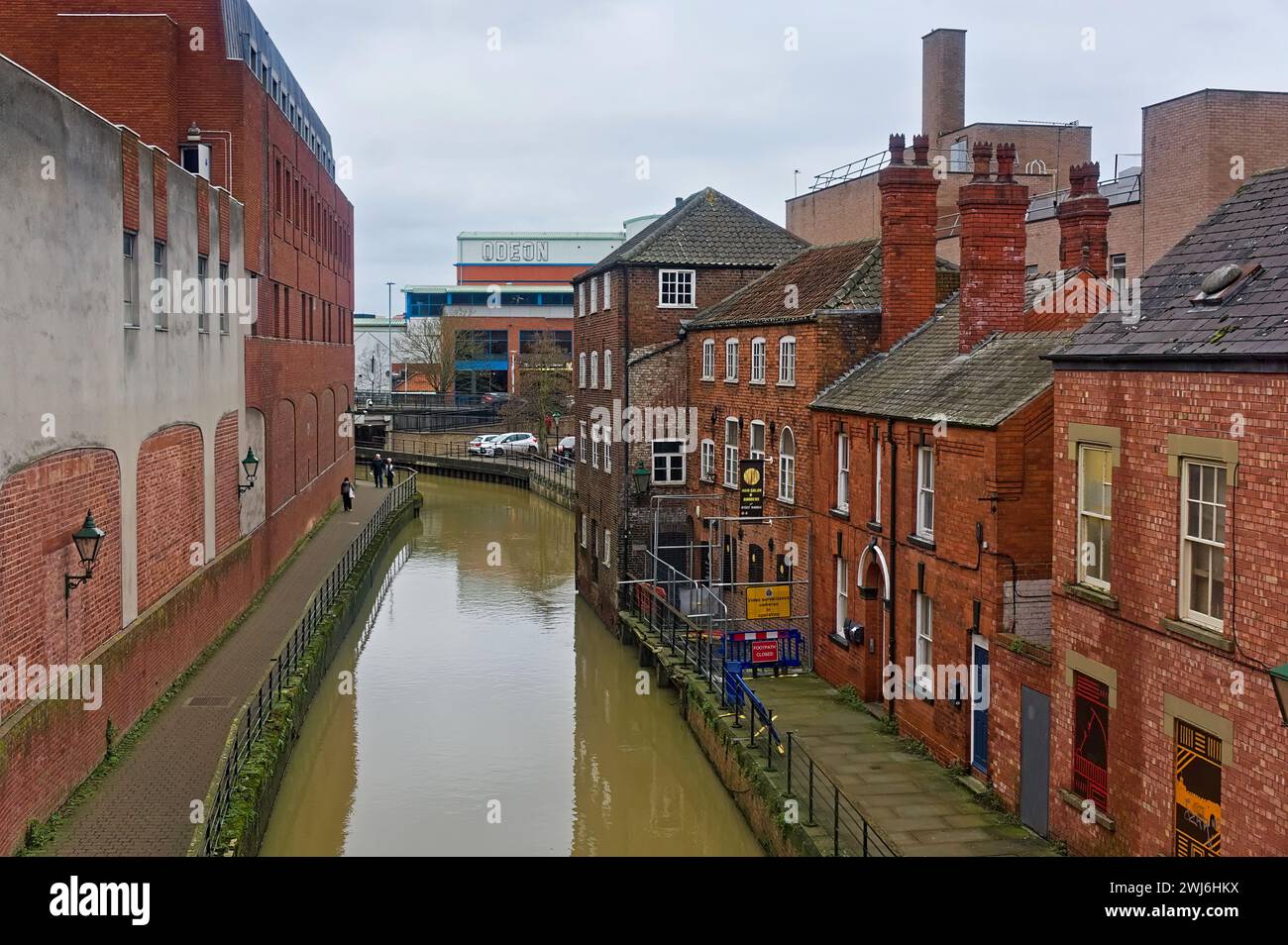 Riverside buildings on The River Witham in Lincoln with the ODEON Cinema in the distance. Stock Photo